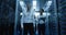 Workers in a data center walking between rows of server racks