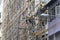 Workers dismantle the bamboo scaffolding outside the building