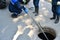 Workers dismantle the telecommunication cable in the well