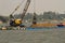 Workers dredging the Mekong River in Vietnam