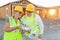 Workers with Drone Quadcopter Inspecting Photographs on Controller