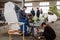 Workers are engaged in the manufacture of a wind turbine in the factory floor