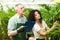 Workers examining plants