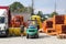 Workers with forklifts in a warehouse of plastic pipes. Sale of materials for construction and upgrading of the territory. Industr