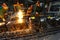 Workers in a foundry casting a metal workpiece - safety at work and teamwork