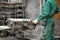 Workers in a foundry - production of steel castings in an industrial company