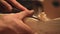 Workers hands of a male carpenter closeup cuts a tree