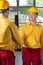 Workers handshake in a factory