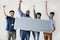 Workers holding blank board together