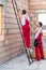 Workers holding wooden balk