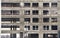 Workers install double-glazed windows in a building under construction