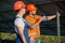 Workers installing photovoltaic panels at solar energy station.