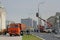 Workers lay a lawn and produce electrical installation on a lamppost in Moscow