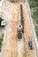 Workers lay paving tiles top view from a drone