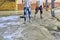 workers leveling concrete of a new building