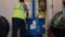 Workers load goods on a truck and taken to the warehouse. Employees Warehouse worker driver in uniform at storage