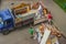 Workers load old furniture into the back of a truck to transport