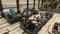 Workers in masks tighten nuts doing work on the assembly line of the wheel frame of the train, in the assembly shop of