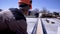 Workers of measuring wooden boards at construction site. Clip. Builders make measurements of boards for construction of