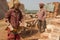 Workers move bricks at a factory in Dhaka, Bangladesh.