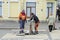 Workers in overalls install a hydrant and attach a hose