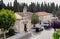 Workers and people next to a hearse at the entrance of the San Atilan municipal cemetery in Zamora, Spain with a top view.