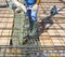 Workers pouring concrete on big floor construction