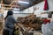 Workers process pulp at a small paper factory