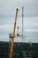 Workers in the process of removing a tower crane disassembling