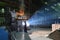 Workers in protective equipment in a foundry during the production of steel components - workplace industrial factory