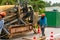 Workers removed a layer of asphalt from the road to lay pipes. Repair construction work on the street of the island in Thailand