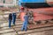 Workers repairing rudder ship at shipyard in Dutch village Urk