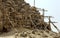 Workers restoring a corner section of the Bent Pyramid at Dahshur in Egypt take a rest break.