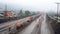 Workers on a road construction site in the foggy morning