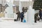 Workers shovels to remove the snow on the ice town