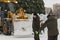 Workers shovels to remove the snow on the ice town