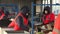 Workers sort garbage at a waste recycling plant.