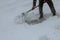 Workers sweep snow from road in winter, Cleaning road from snow storm.