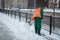 Workers sweep snow from road in winter, Cleaning road from snow storm.