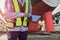 Workers with tablet in hand at floating dry dock in shipyard