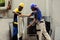 Workers taking apart hvac system panel