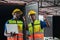 Workers team taking inventory in factory warehouse, Manual workers working in warehouse talking about job, Foreperson checking the