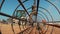 Workers and a tractor with a drilling device at a construction site - view from inside construction steel rod