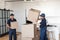 workers in uniform stacking carton packages