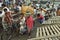 Workers unload boats in busy port Dhaka