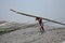 Workers unload cargo from the boat in Gosaba, India