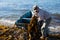 Workers unload seaweed kelp from the boat to shore.