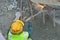 Workers using blowtorch to cutting metal at construction site.