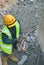 Workers using blowtorch to cutting metal at construction site.