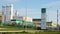 Workers Walk at Modern Refinery Plant and Fur Tree